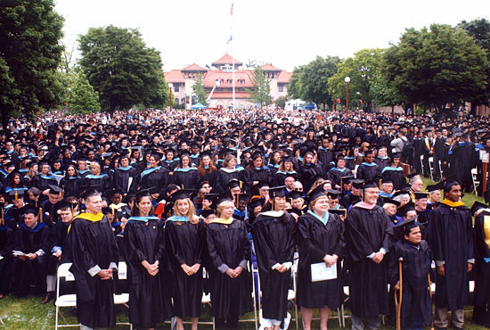 Graduates standing at start of Commencement Ceremony